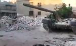 fronten. Dette billede er angiveligt taget i sidste uge i Aleppo. Det viser - igen angiveligt - syriske oprørere, som har erobret en af hærens kampvogne. 