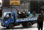 OPRØRERE. Oprørssoldater i Azaz nær Aleppo fotograferet under kampene med Assads hær. 
