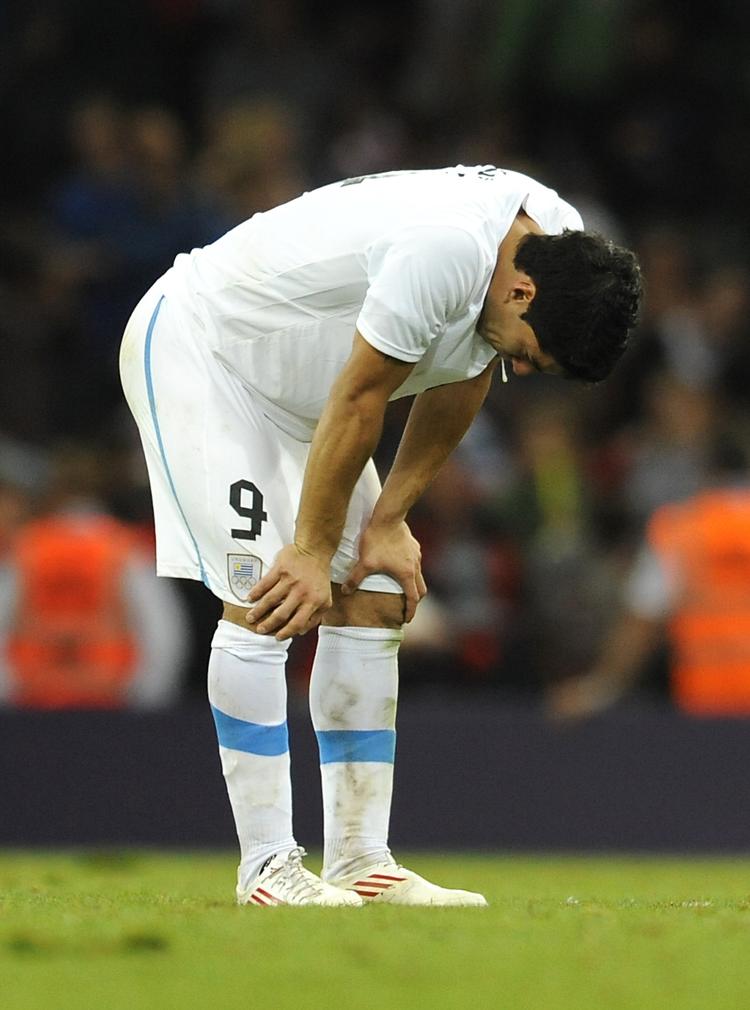 Exit. Luis Suarez og Uruguay tabte 1-0 til briterne i sidste spillerunde. 