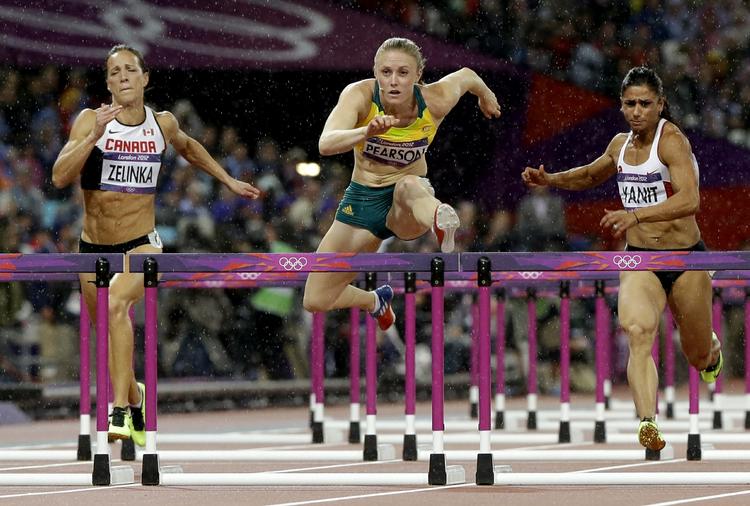hop. Australske  Sally Pearson (midt)  var hurtigst over hækkene og vandt guld i tæt opløb med Dawn Harper. 