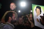 optur. Saif al-Islam Gaddafi, der var sin far, Moamar Gaddafis, loyale støtte, fotograferet 23. august sidste år. Han var rapporteret fanget af oprørerne, da han pludselig dukkede op i Tripoli. 
