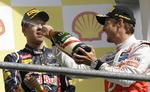 eftertragtet. Red Bulls verdensmester Sebastian Vettel (tv) har vænnet sig til at få champagne efter løbene i Formel 1. 