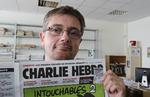 KARIKATUR. »Tegningerne vil chokere dem, der vil chokeres«, siger udgiveren af det franske satiriske magasin Charlie Hebdo, illustratoren Charb, der her viser forsiden på ugens udgave, der bringer nye karikaturtegninger af Islam-profeten Muhammed. 