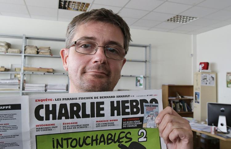 KARIKATUR. »Tegningerne vil chokere dem, der vil chokeres«, siger udgiveren af det franske satiriske magasin Charlie Hebdo, illustratoren Charb, der her viser forsiden på ugens udgave, der bringer nye karikaturtegninger af Islam-profeten Muhammed. 
