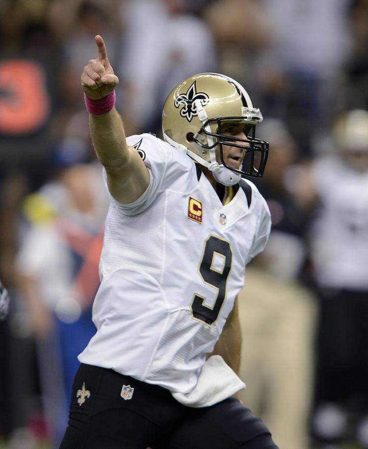 rekord. New Orleans Saints quarterback, Drew Brees, jubler efter at have sat en historisk milepæl i NFL. 