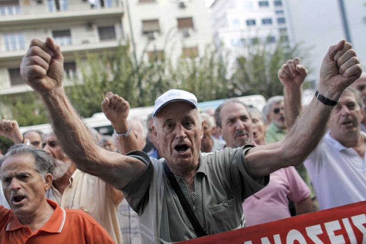 Protest. Allerede i går var tusindvis af vrede grækere på gaden for at protestere mod den tyske kansler Angela Merkels besøg i Athen i dag. 