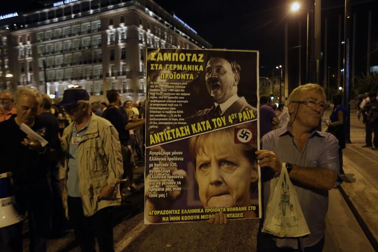 Protest. Hackergruppen Anonymous går nu efter græske hjemmesider samme dag som den tyske forbundskansler ankommer til Athen. 