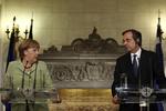 Pressemøde. »Jeg ønsker, at Grækenland bliver i eurozonen«, siger kansleren efter sit møde med den græske premierminister, Antonis Samaras. 