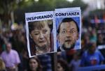nedtur. Spanierne har demonstreret talrige gange mod den hårde sparekur, politikerne har sat dem på. Billedet er fra en demonstration sidste lørdag i Madrid. 'Inspirerende tillid' står der på plakaten med den tyske kansler Angela Merkel og hendes spanske kollega Mariano Rajoy. 