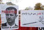 Modstand. Verden over er der jævnligt demonstrationer mod Bashar al-Assad. I går protesterede den franske organisation 'Journalister Uden Grænser' i Paris. 