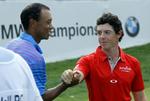 OVERGÅET. Trods en god score blev Tiger Woods (tv.) overgået af en brandvarm Rory McIlroy (th.). 