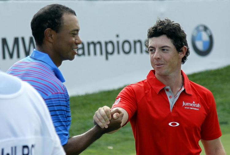 OVERGÅET. Trods en god score blev Tiger Woods (tv.) overgået af en brandvarm Rory McIlroy (th.). 