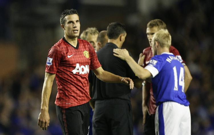 rivaler. Robin van Persie spiller nu i Manchester Uniteds trøje og er gæst lørdag hos sin tidligere klub Arsenal. 