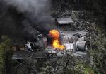 MINEULYKKE. Flammerne står op fra en udluftningsskakt ved Pike River-minen syd for Greymouth på Sydøen i New Zealand. 
