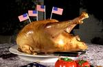 Amerikansk. Intet bliver mere amerikansk end en  Thanksgiving-kalkun. Med flag i. 
