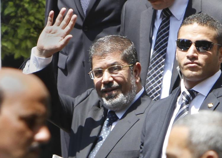 Udskældt. Mohammed Mursi har ikke siddet længe i sit embede, før benhård kritik vælter ned over ham. 
