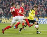 BESEJRET. Trods en føring tabte Mainz med Bo Svensson (i midten) til Dortmund. 