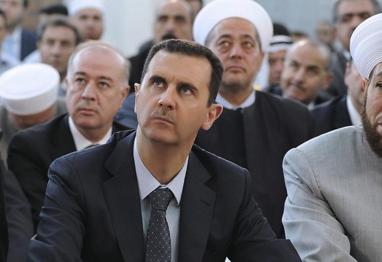 Tale. Syriens præsident, Bashar-al Assad, lukker døren på klem for en fredsforhandling med landets oprørere. 