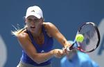Ulideligt. Caroline Wozniacki måtte kæmpe sig gennem 42 graders varme i Australien. 