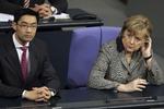 Makker. Angela Merkel skal måske til at vænne sig til at have en ny FDP-formand ved sin side. Philipp Rösler (til venstre) er parat til at trække sig som partiformand for FDP. 