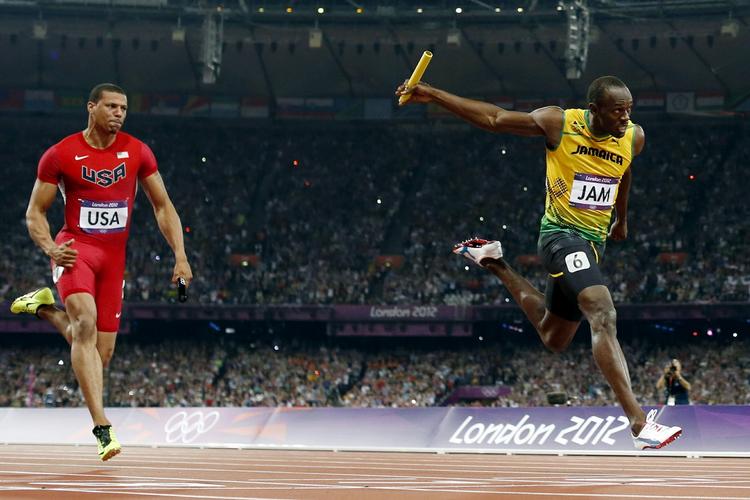 tjept. Usain Bolt (th) høstede kun guld i sine løb ved OL. 