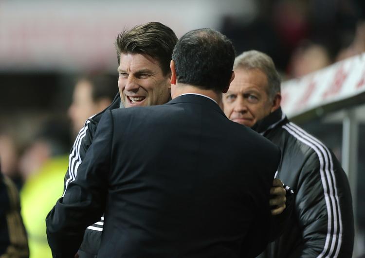 Michael Laudrup og Swansea er to pladser foran Liverpool i Premier League. 