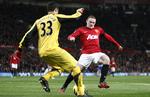 liga-hop? Queens Park Rangers' brasilianske målmand Julio Cesar (tv) redder et forsøg fra Manchester Uniteds Wayne Rooney. 