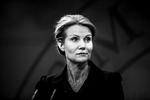 Translation. Statsministeren er under beskydning for at pryde sig med ¨ånte fjer. 