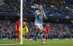 Deling. Edin Dzeko var med til at sikre City et point imod Liverpool søndag. Manager Mancini tror stadig på, at det kan blive til guld. 