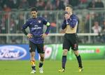 Sejr. Det er sjældent, at Mikel Arteta (t.v.) og  Laurent Koscielny ikke kan bruge en 2-0-sejr til noget,. men i aftes i München var det ikke nok til avancement. 