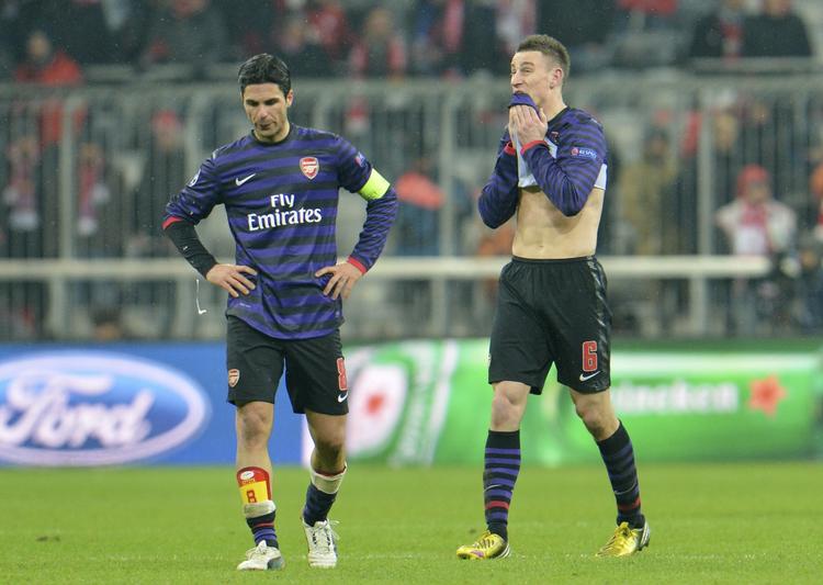 Sejr. Det er sjældent, at Mikel Arteta (t.v.) og  Laurent Koscielny ikke kan bruge en 2-0-sejr til noget,. men i aftes i München var det ikke nok til avancement. 