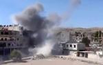 Borgerkrig. Kampene mellem regeringensstyrkerne og oprørerne fortsætter i forstæderne til Syriens hovedstad Damaskus. Der her er et billede fra sammenstødene byen Maadamiyeh i går. 