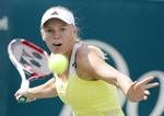 Videre. Caroline Wozniacki gik i tredje runde glip af en kamp, da Andrea Petkovic trak sig. 