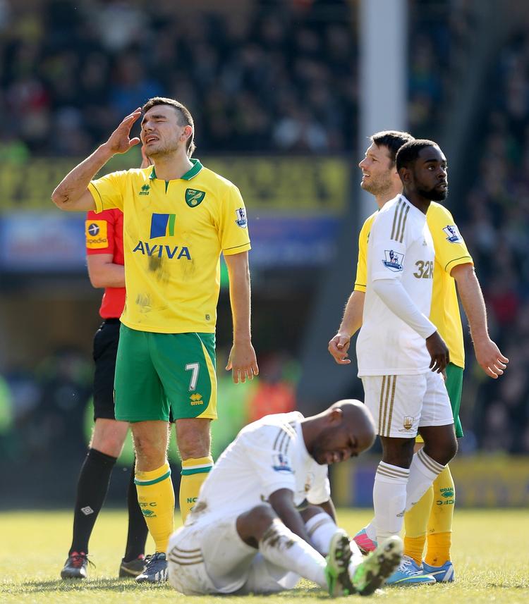 2-2. Swansea og Norwich delte i porten, hvilket Robert Snodgrass (t.v.) ikke var helt tilfreds med. 