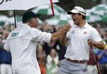MASTERSVINDER. For Adam Scott var den første sejr i Masters, men hans newzealandske caddie, Steve Williams, har tre gange tidligere vundet med Tiger Woods. 
