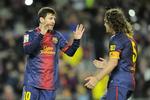 SKADET. Lionel Messi (tv) og Carles Puyol er begge tvivlsomme til Champions League-kampene mod Bayern München. 