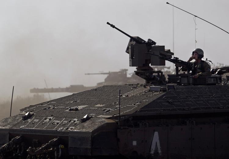 Optrapning. Israel har sendt elitestyrker til grænsen mod Syrien, og rykket kampvognene tættere på grænsen. Billedet her er fra Golan-højderne. 