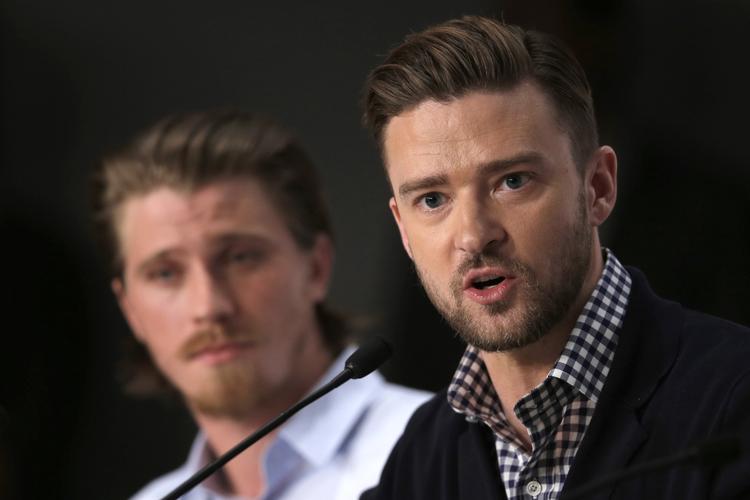 Justin Timberlake med Garrett Hedlund  i baggrunden til pressemødet på Coen-brødrenes nye film. Filmen fortæller historien om en ung singer-songwriter på folkscenen i New York i 1960'erne. 