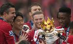 klubskifte? Selv om Wayne Rooney (midt) var glad for Manchester Uniteds mesterskabstitel, så er angriberen ikke tilfreds med sin rolle på holdet. 