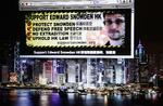Støtte. En hjemmeside til støtte for whistlebloweren Edward Snowden opfordrer til et forsvar af informationsfriheden. I baggrunden ses Hong Kong, hvor Snowden menes at befinde sig. 
