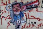 kindhest. Et vægmaleri viser, hvad en stor del af egypterne mener om deres præsident, Mohamed Morsi. 