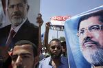 Støtter. Tilhængere af den afsatte præsident Mohamed Morsi  er på gaden i Kairo. 