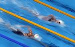Hurtigst. Den olympiske 800 meter fri-mester, Katie Ledeccky (th.), var hurtigst i det indledende heat på den halve distance, da VM blev indledt i dag. 
