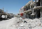 Krigens spor er tydelige som her langs en gade i Qusair. 