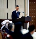URO. Informationsministeren afviser, at oprørere havde held til at angribe en kortege med Assad. Her ses Assad på et billede, der blev frigivet af regimet tidligere på ugen. 