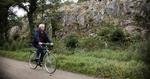 Bornholm. Jernbanen mellem Rønne og Svaneke blev nedlagt i 1953. Hardy Pedersen, chef for vej- og havneområdet i regionen, fik omlagt jernbanens tracé til cyklesti mellem Rø og det meste af strækningen til Rønne. Her er Hardy Pedersen ved Kleven, hvor banen er sprængt gennem klipperne. 