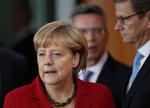 Valg. Hjemlig kritik får nu Angela Merkel til at sige, at det var en fejl af grækerne kom med i euroen. 