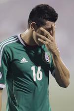 presset. Mexicos Hector Herrera hænger med hovedet efter nederlaget på 2-0 til USA. 
