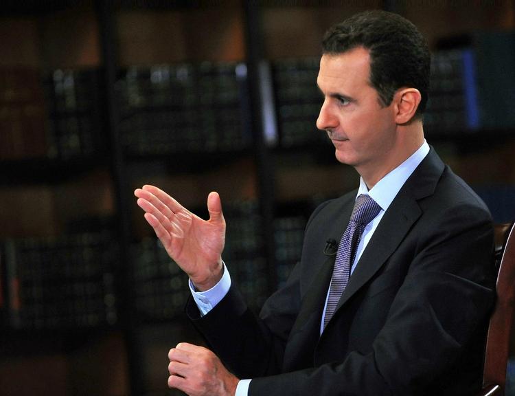 Advarsel. Tyrkiet vil komme til at betale dyrt for, at det støtter oprørere, der vil vælte det syriske regime, siger Syriens præsident, Bashar al-Assad, i et tv-interview. 