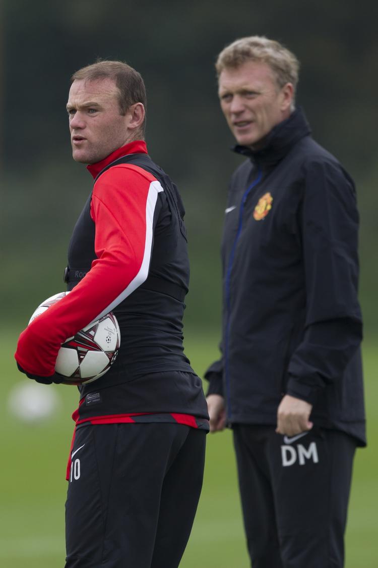 utilpasset. Manchester Uniteds Wayne Rooney (tv) føler sig igen godt tilpas i klubben efter den nye træner, David Moyes (th), har fundet plads i angrebet til den engelske landsholdsspiller. 